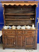 18th cent. Welsh oak/elm dresser with ornate fruit wood frieze to shelves. Base with two long