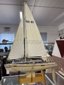 Late 20th cent. Plastic model of yacht 'Odyssey' on plywood stand.