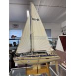 Late 20th cent. Plastic model of yacht 'Odyssey' on plywood stand.