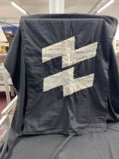 Militaria: Third Reich, a black cotton flag bearing white SS Runes.