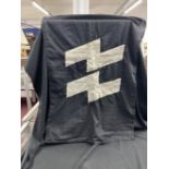 Militaria: Third Reich, a black cotton flag bearing white SS Runes.