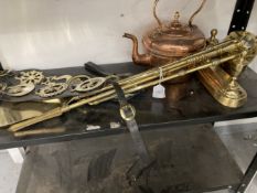 20th cent. Metalware: Brass companion set, tea caddy, horse brasses and copper kettle.