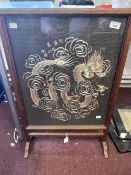 Early 20th cent. Glazed oak fire screen with a Chinese silk depicting a four clawed dragon chasing