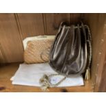 Fashion Handbags: Tan woven straw clutch bag, black lining. Bronze leather bag silver and gold
