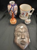 Ceramics & Miscellania: Staffordshire style frog mug, Oriental vases, and a treen tribal mask. (5)