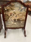 20th cent. Woolwork fire screen in ornate rosewood frame.