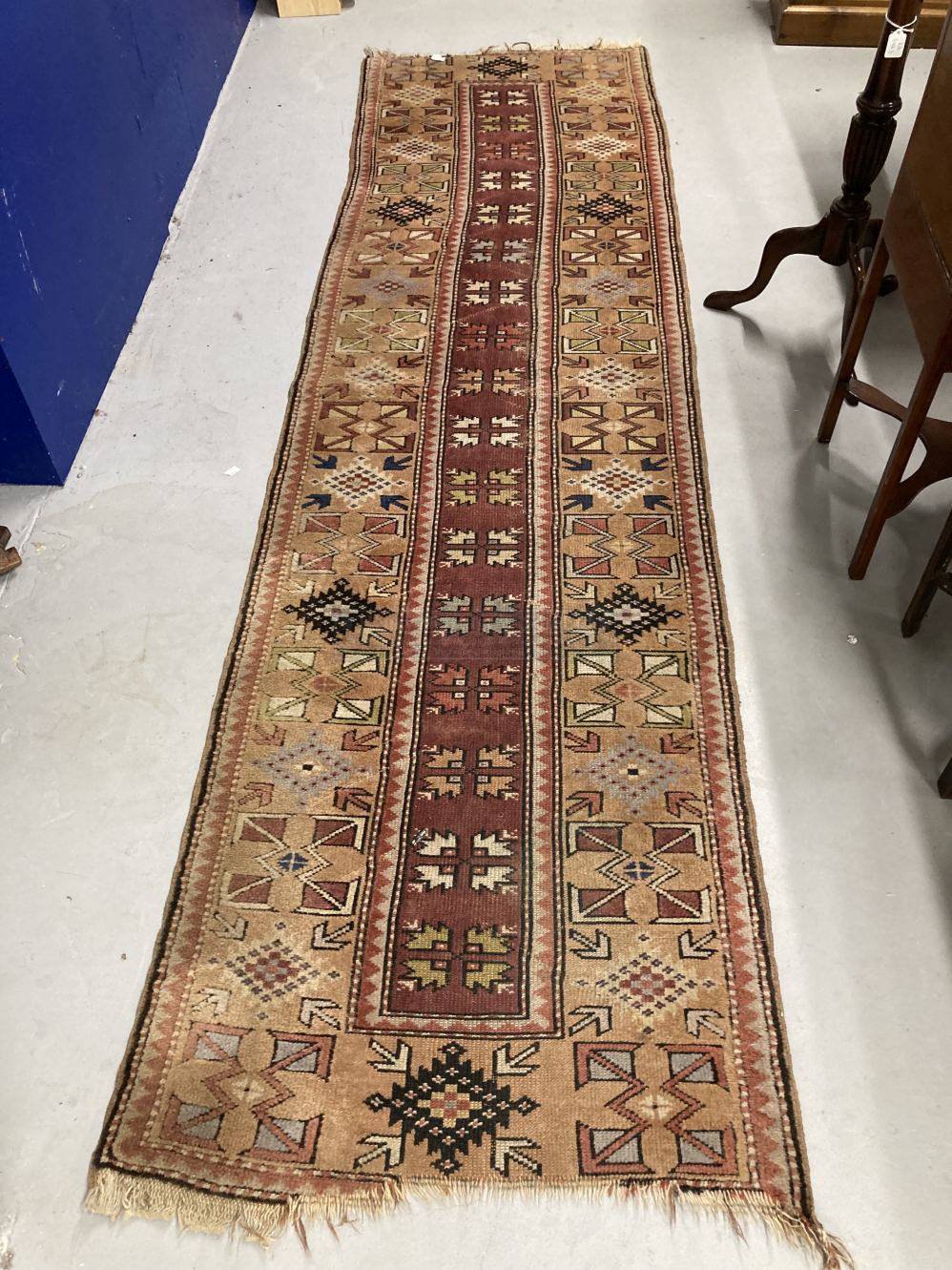 Carpets & Rugs: 19th cent. Turkaman runner, geometric designs on beige ground with reds, blues,