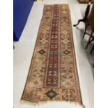 Carpets & Rugs: 19th cent. Turkaman runner, geometric designs on beige ground with reds, blues,