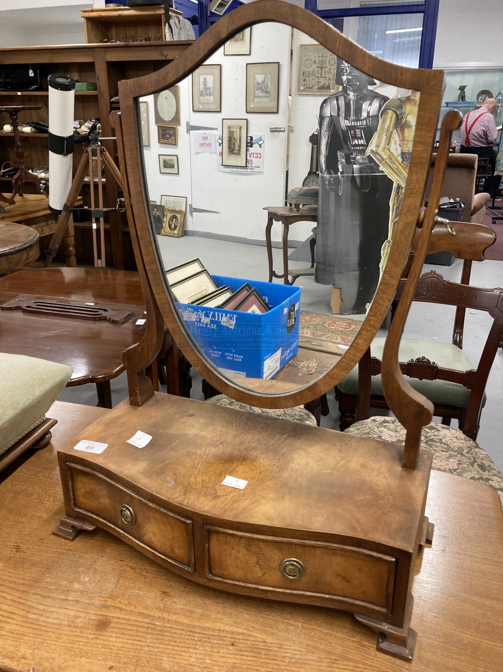 20th cent. Mahogany shield shaped dressing table mirror with two drawers to base, together with a