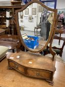 20th cent. Mahogany shield shaped dressing table mirror with two drawers to base, together with a