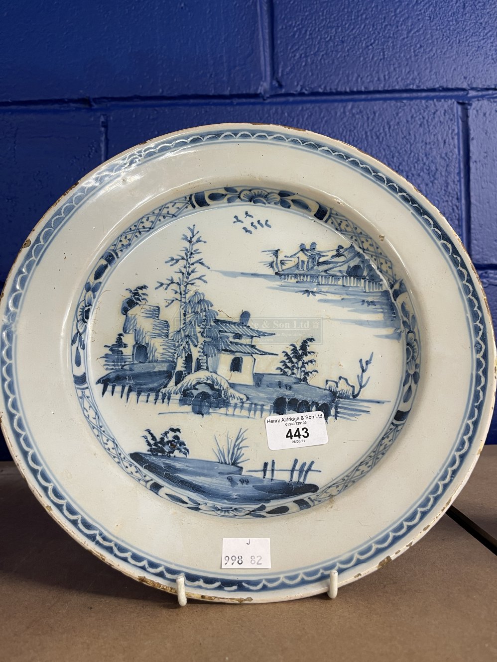 Ceramics: 18th cent. Tin glaze earthenware Delft charger decorated in the Chinese style. 12ins.