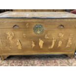 20th cent. Chinese camphor wood marriage chest decorated with stylised figures. 42ins. x 22ins.