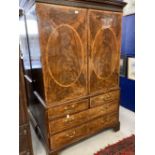 19th cent. Flame mahogany linen press two opening inlaid doors revealing five slides, two over three