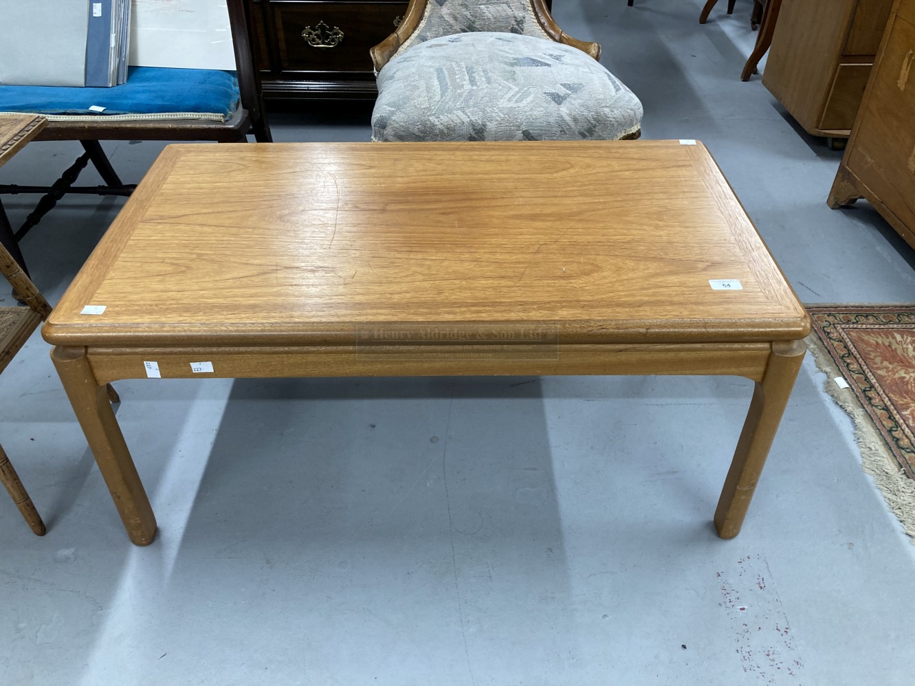 Mid 20th cent. Teak coffee table with Nathan Manufacturers label to underside. 36ins. x 21ins.