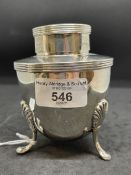 Halmarked Silver: Tea caddy, urn shaped, with cover, three shell shaped supports. 1998/99,