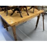 20th cent. Pine kitchen table with one central drawer, on turned supports. 47ins. x 31½ins.