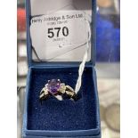 Hallmarked Jewellery: 9ct gold ring set with an oval amethyst, estimated weight 2.5ct, and twelve