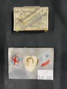 Militaria: WWI trench art white metal matchbox holder, together with an aluminium photograph fram,e,