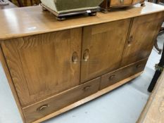 20th cent. Ercol style Windsor oak sideboard. Three cupboards over two drawers with two cutlery