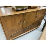 20th cent. Ercol style Windsor oak sideboard. Three cupboards over two drawers with two cutlery