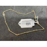 Jewellery: Yellow metal twisted bar link chain stamped 585, tests as 14ct gold. Length 15¾ins. Width