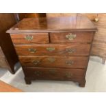 George III mahogany chest of two over three drawers of good colour on raised bracket supports.