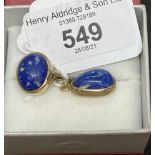 Jewellery: Yellow metal, pendant ring set with an oval cabouchon cut lapis lazuli, a 15¾ins trace