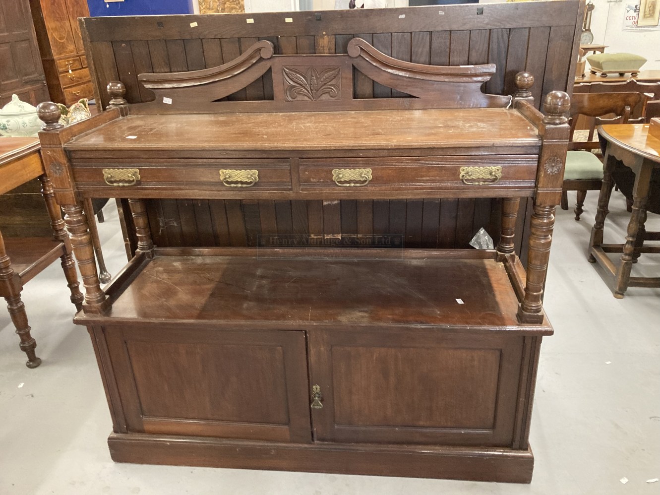 Early 20th cent. Oak buffet with carved floral decoration and brass furniture. 54ins. x 51ins. x