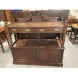 Early 20th cent. Oak buffet with carved floral decoration and brass furniture. 54ins. x 51ins. x