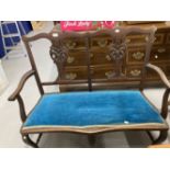 20th Cent. Chippendale style 2 seater hall seat with blue upholstered drop in seat.