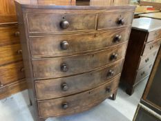 19th cent. Mahogany bow front chest of two short drawers and four graduated long drawers on swept