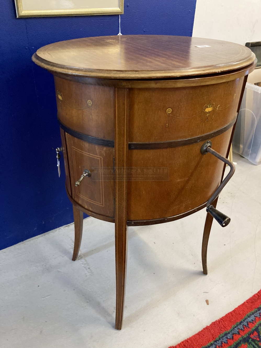 Ear;y 20th cent. 'Tyrela' mahogany oval wind up gramophone on four supports, double doors to front