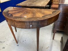 Georgian mahogany, satinwood and marquetry dressing table the demi lune top enclosing a fitted