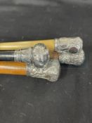 Walking sticks, two silver topped, two white metal one dated 1887. (4)