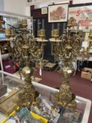 20th cent. Ornate brass candle garniture of five nozzles over decorative bases with rampant lion