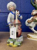Ceramics: Hochst figure of a boy standing with a cello, in white coat and pale yellow breeches,