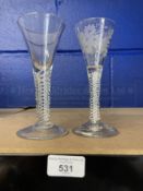18th/19th cent. Wine glasses both spiral decorated stems, one with leaf decoration to the bowl.