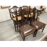 20th cent. Mahogany dining chairs, shield corn sheaf backs with Rexine drop in seats. (6)