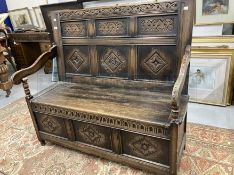 20th cent. Oak monks bench, matching carved panels. 47ins. x 42ins. x 22ins.