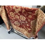 21st cent. Madder red ground rug with gold stylised floral decoration. 75ins. x 52ins.