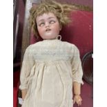 Dolls: Simon & Halbig Model 1079. Early 20th cent. Bisque head and composite doll with jointed