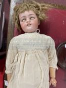 Dolls: Simon & Halbig Model 1079. Early 20th cent. Bisque head and composite doll with jointed