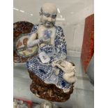 Chinese: Large 19th cent. Japanese, possible Hirado sculpted porcelain figure of a Buddhist monk