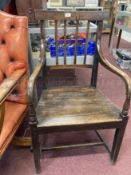 Late 18th cent. English oak and elm elbow chair.