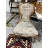 Victorian mahogany spoon back nursing chair upholstered in tapestry fabric.