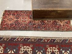 Rugs/Carpets: 20th cent. runner, geometric pattern on a red background . 68ins. x 23ins.