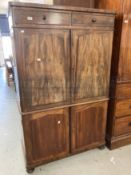 Early 19th cent. Mahogany linen press of modest proportions, two drawers and four cupboards,