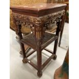Early 20th cent. Chinese carved and stained hardwood two tier stand. Height 32ins. x Width 17ins.