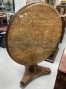 20th cent. Oak round drop top breakfast table on a triangular base. Dia. 37ins. Height 30ins.