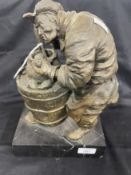 20th cent. Bronze of an old man working at a well on a marble base. Height 12ins.